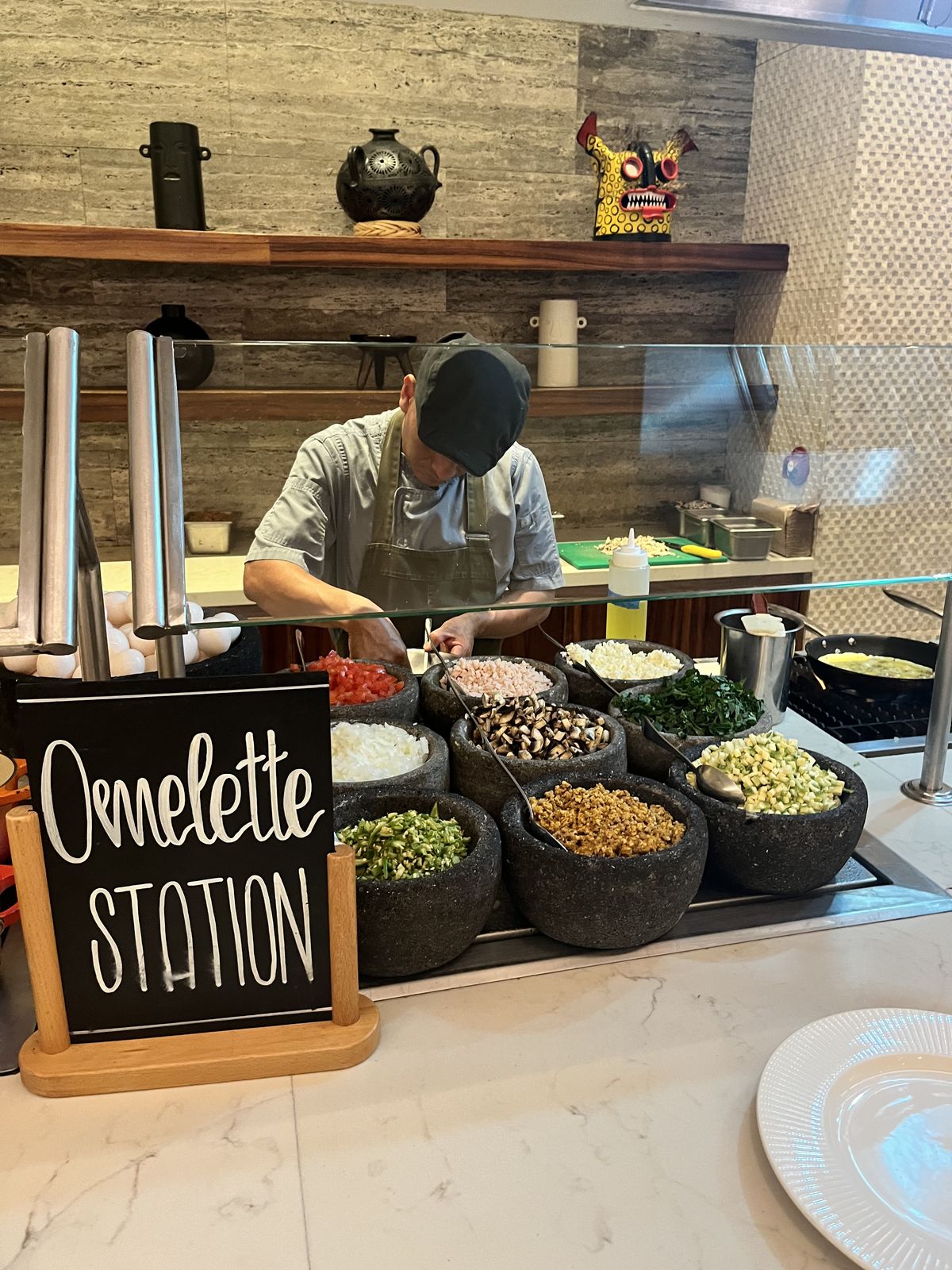 A cook at an omelette station