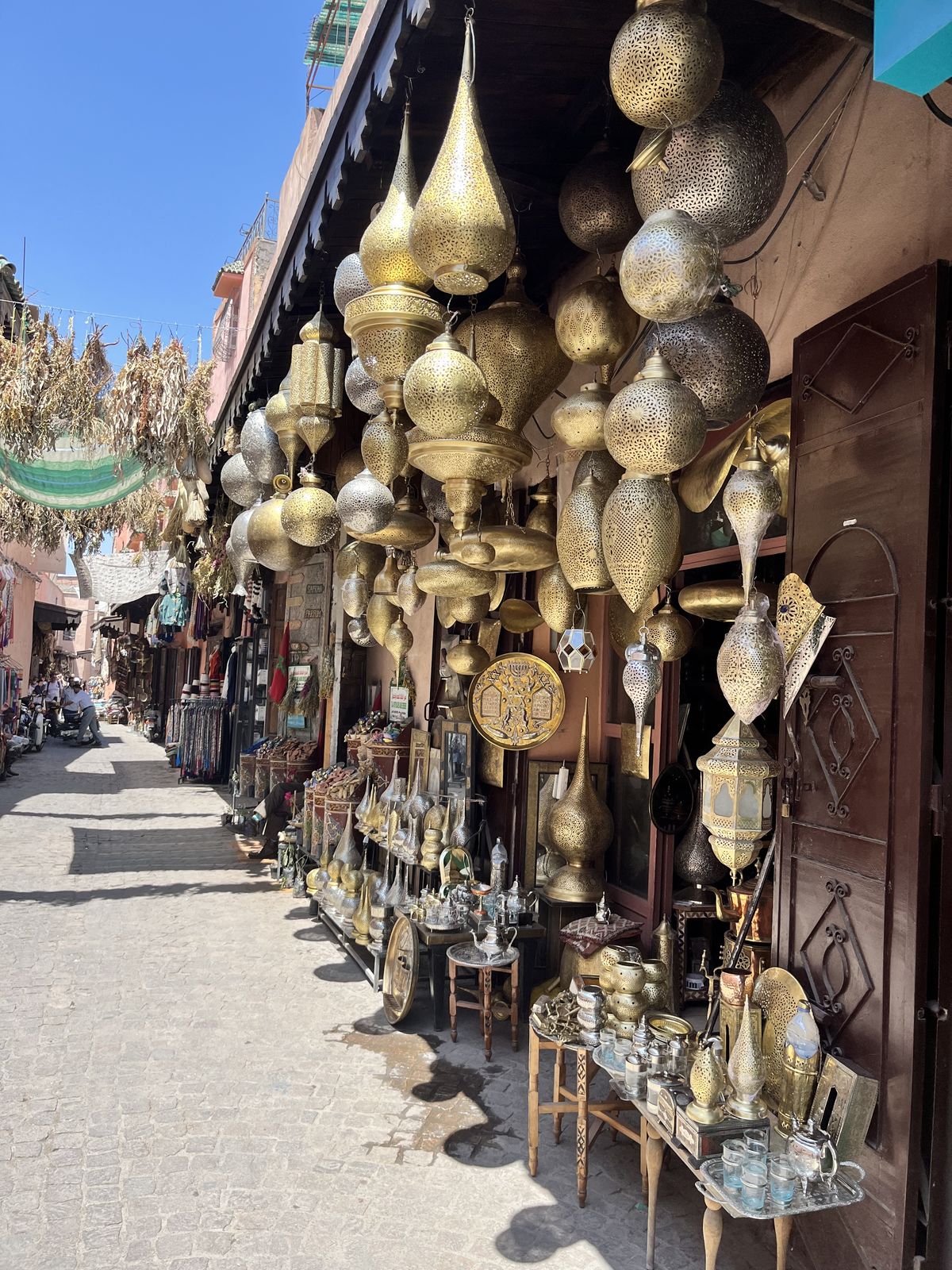 Brass lanterns hanging along a medina street