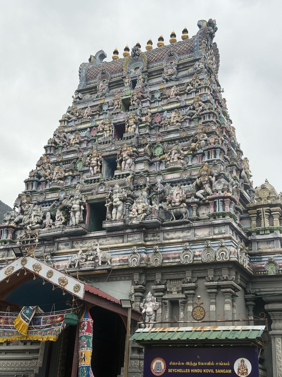 The carved and painted tower of the Hindu temple in Victoria