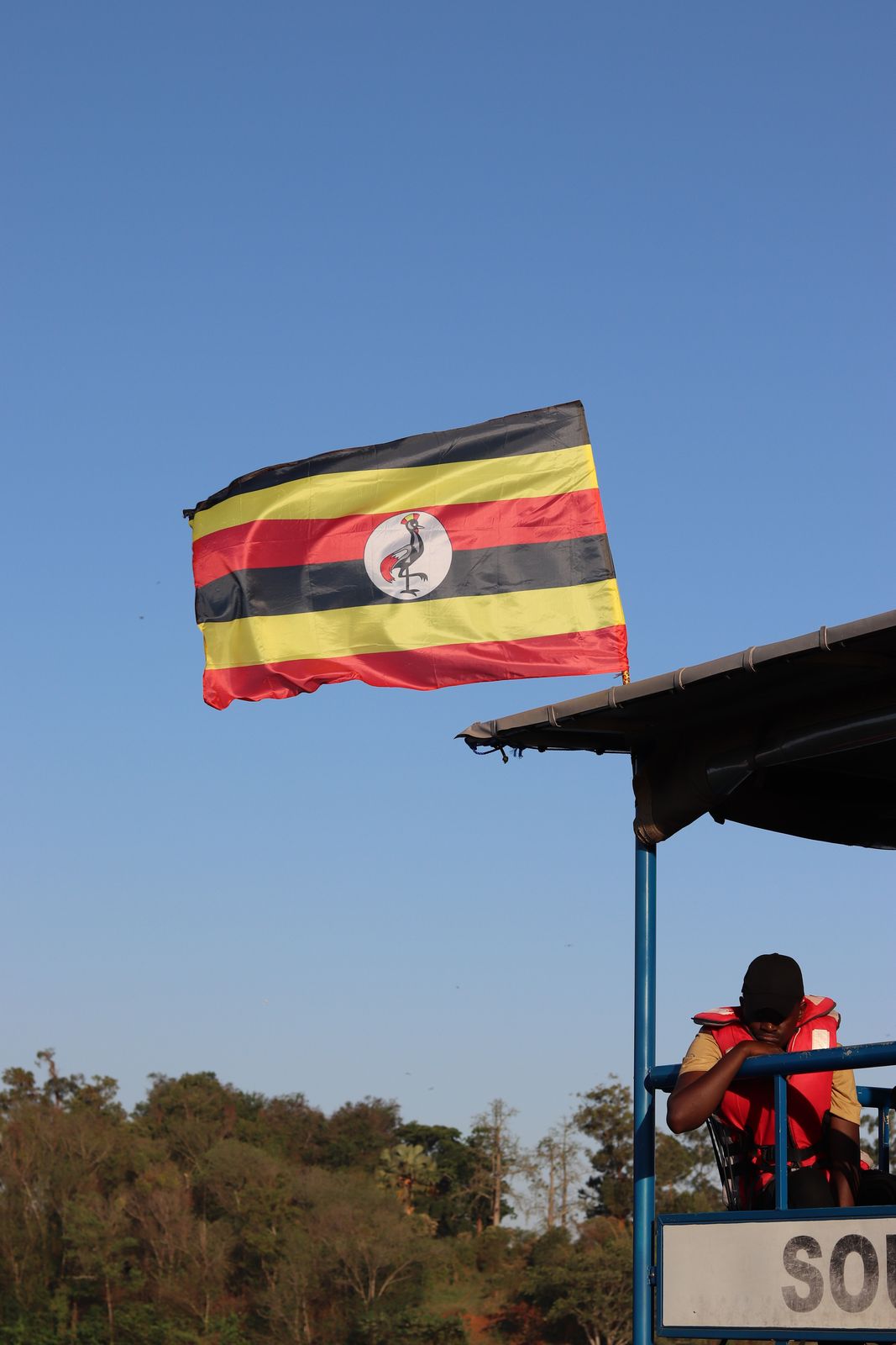 The Ugandan flag flying from a boat on the Nile