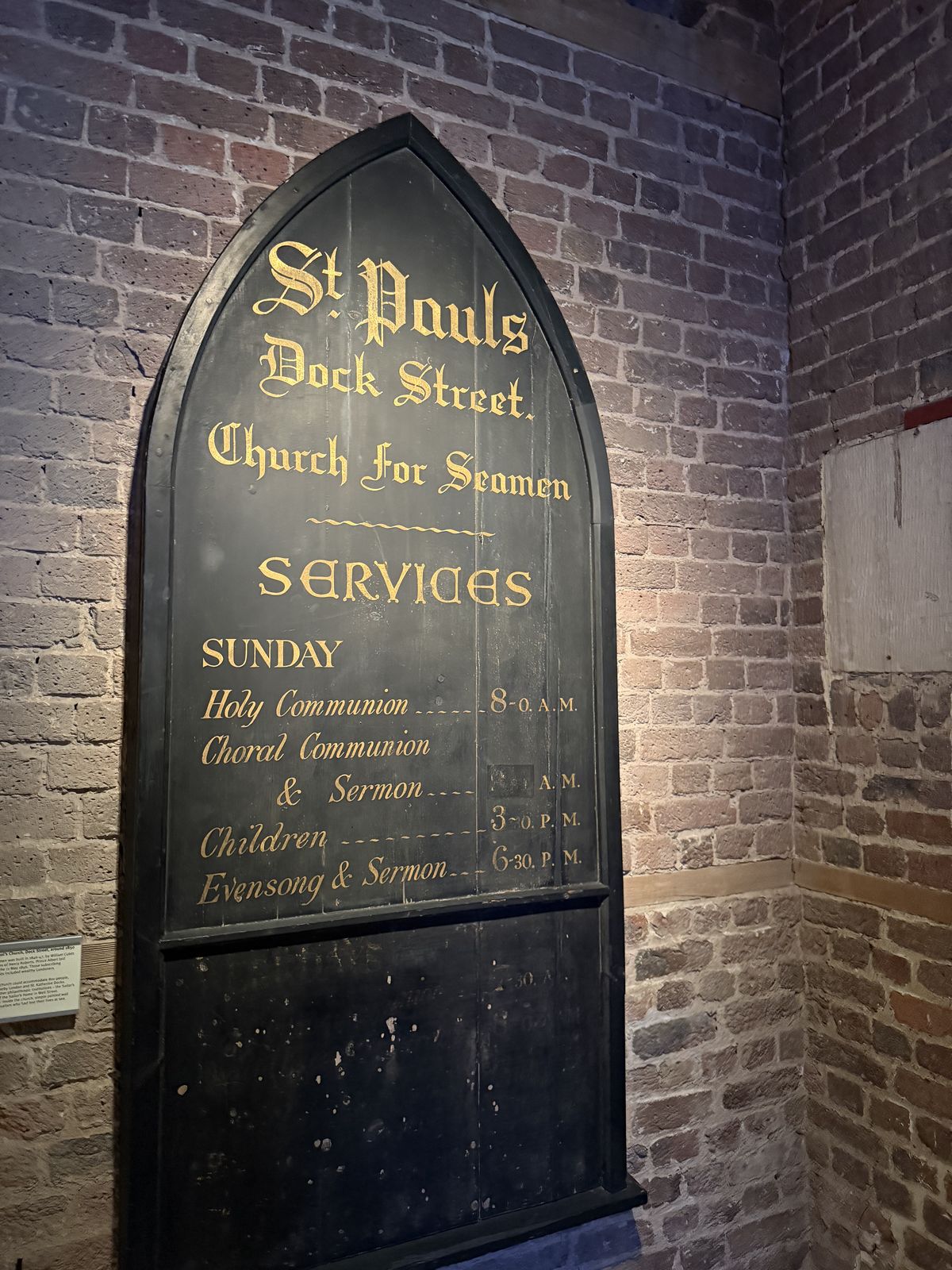 An old painted service board for St Paul's Church for Seamen