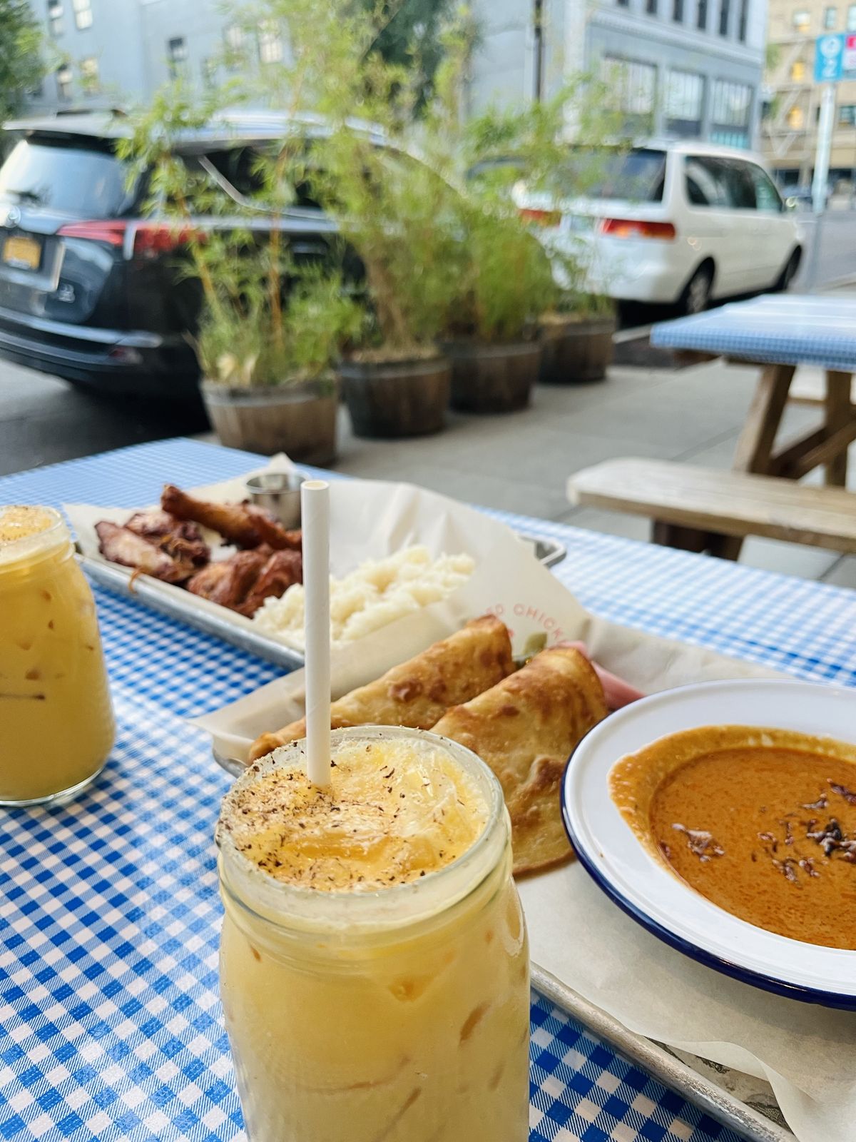 Lunch on a gingham tablecloth outside on the street